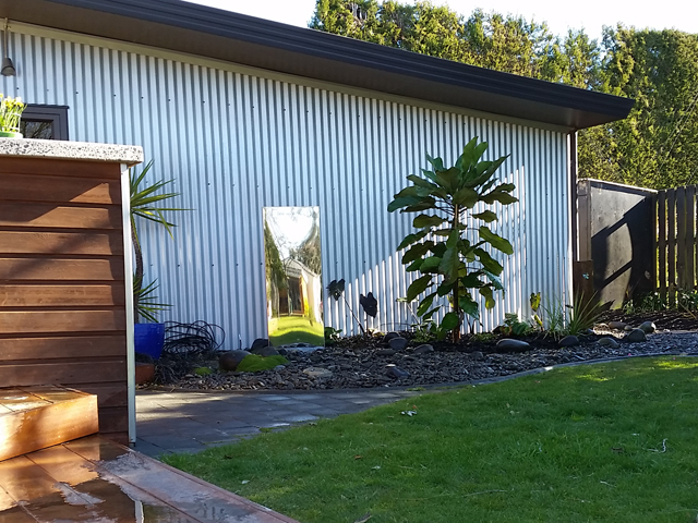 Stainless water feature and puka tree