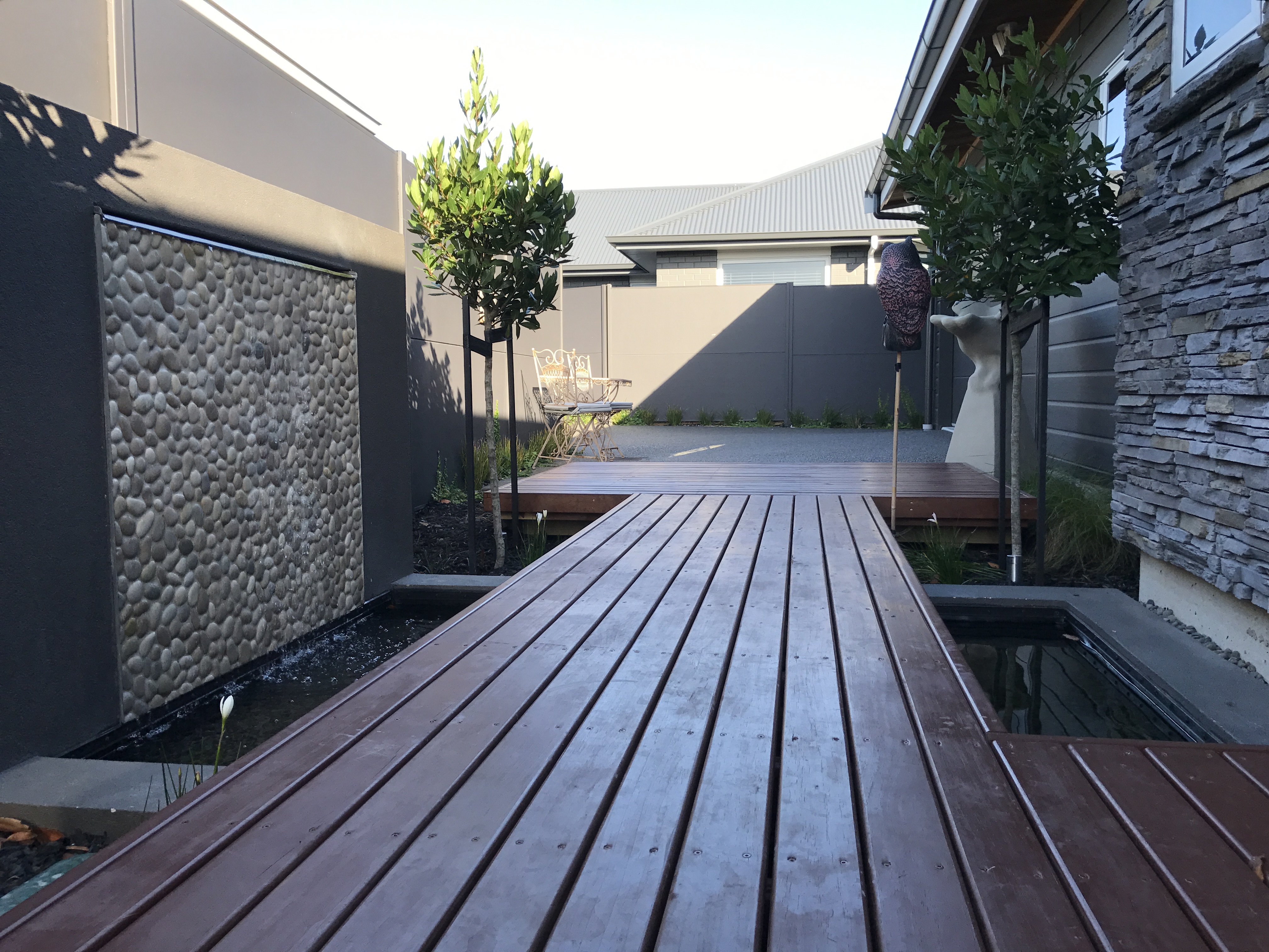 Board walk over water feature pond.